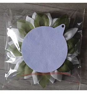 Back view of burlap sunflower wreath home decor in transparent protective packaging