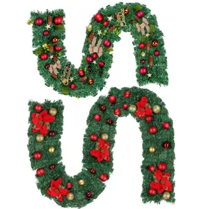 Set of two lush green PVC Christmas garlands featuring red poinsettias and pine cones decorations