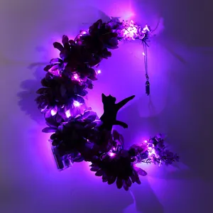 Spooky Halloween moon cat wreath featuring glowing purple LED lights for wall decoration