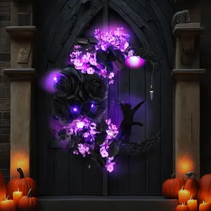 Halloween moon wreath with LED lights black roses and cat silhouette on dark door