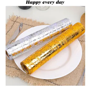 Detailed view of gold and silver bronzing mesh rolls for festive table decoration