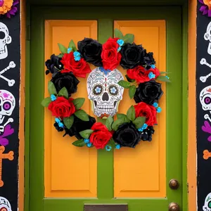 Mexican Day of the Dead wreath with red and black roses and sugar skull on a green door