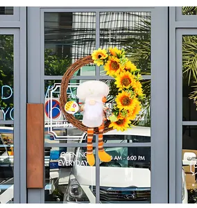 Sunflower wreath with long-legged chef gnome doll hanging on a glass door for home decor