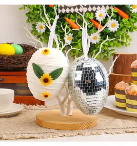 Detail of woven sunflower egg and disco ball egg ornaments for Easter decor.