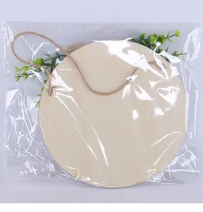 Round wooden bathroom sign with green leaf decor in clear protective packaging bag