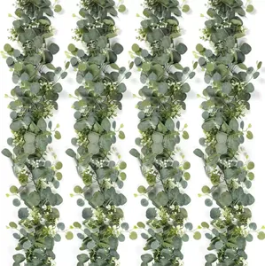 Detailed view of artificial eucalyptus garland with white baby breath flowers for wedding decor