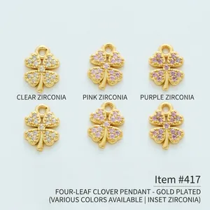 Detailed view of 18K gold plated four-leaf clover charms with colored cubic zirconia