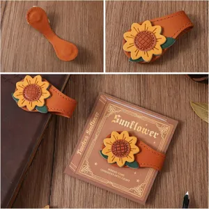 Segnalibro magnetico in pelle con girasole fatto a mano e finitura testurizzata.