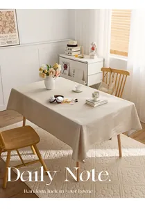 Detailed view of the natural linen texture and drape on a rectangular dining tablecloth