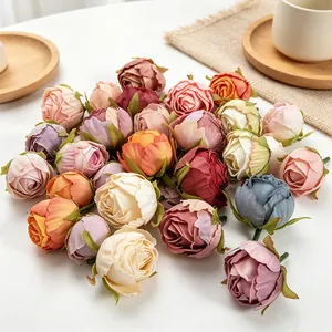 Macro view of vintage scorched edge artificial rose buds in assorted colors