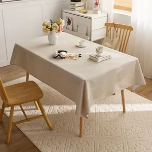 Natural linen style tablecloth shown in a warm, minimalist dining room setting