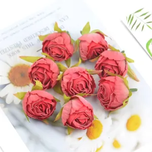 Close-up detail view of artificial vintage rosebuds made of silk for DIY floral crafts