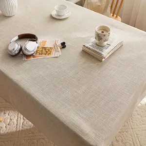 Elegant beige cotton linen tablecloth with premium woven texture for a cozy home feel.