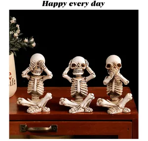 Three skeleton figurines in 'Hear No Evil, See No Evil, Speak No Evil' poses for Halloween decor