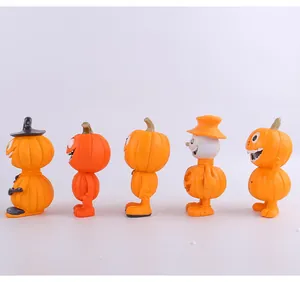 Vue détaillée de cinq figurines de citrouille d'Halloween en résine pour décor festif