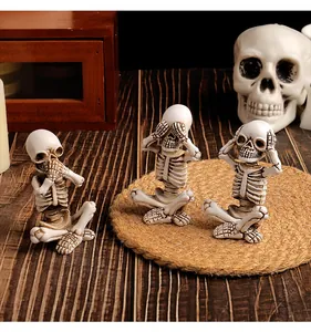 Set of three 'See No Evil, Hear No Evil, Speak No Evil' Halloween resin skeleton figures.