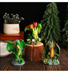 Detail view of three colorful resin dragon figurines for outdoor garden decor