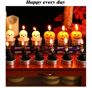 Detail view of assorted Halloween candles in skull, pumpkin, cat and witch shapes.