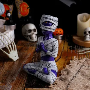 Spooky purple meditating mummy resin figurine for a Halloween desktop decoration