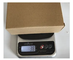 Packaging weight measurement for Halloween resin skull set showing 38 grams
