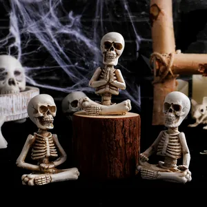Set of three meditating resin skeleton figurines for gothic Halloween desktop decor