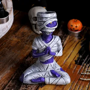 Creative Halloween purple mummy resin ornament in a meditation skull pose for desktop decor