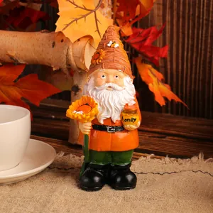 Charming resin garden gnome holding a sunflower and honey pot for autumn decor