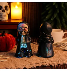 Close-up of Halloween resin skeleton figurine with front LED glow and back view