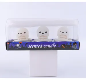 Detailed view of Halloween skull scented candle set in transparent gift packaging