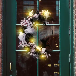 Halloween moon wreath with black roses, white flowers and lights for front door decor