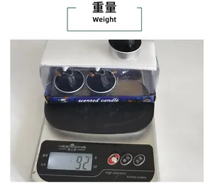 A set of Halloween scented candles being weighed at 92g on a digital kitchen scale