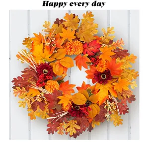 Detailed view of an autumn wreath featuring vibrant maple leaves and red flowers for decor