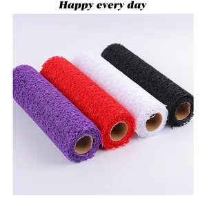 Detailed view of colorful hollow jacquard mesh rolls for flower wrapping and DIY decoration