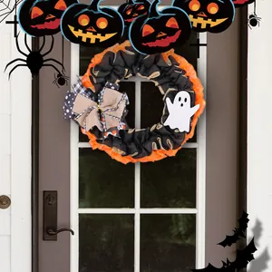 Halloween wreath with orange and black burlap, featuring a ghost and bow on a door