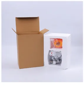 Halloween resin skeleton and pumpkin ornament shown with secure foam and box packaging