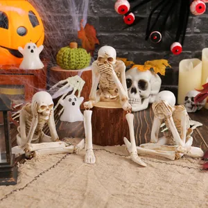 Halloween resin skeleton set in see-hear-speak no evil poses for spooky festive decor
