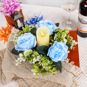 Floral candle ring centerpiece with blue roses and LED candle for elegant table decor