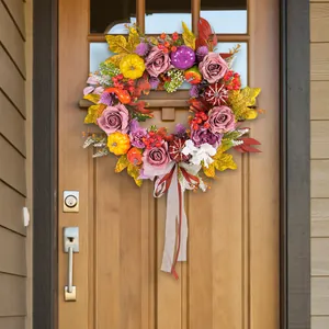 Autumn harvest wreath with roses and pumpkins for farmhouse front door decoration