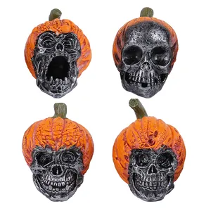 Set of four resin Halloween skull ornaments inside orange pumpkin shells for scary decor