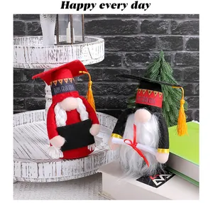 Cute graduation gnomes with doctoral hats and golden tassels for desktop decoration