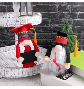 Graduation gnomes with doctor hats and tassels standing on a desktop setup