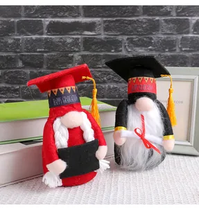 Close-up of adorable graduation gnomes wearing doctor hats for festive desk decor