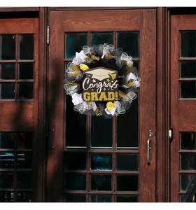 Detail view of mesh graduation wreath featuring wood Congrats Grad sign on a door.