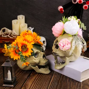 Set of decorative Halloween skulls with sunflowers and flowers for party decor