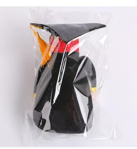 Faceless graduation gnome doll with black mortarboard and tassel in clear plastic packaging