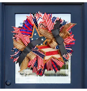 Detailed view of Fourth of July patriotic wreath with stars stripes and burlap ribbons