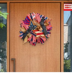 Patriotic Fourth of July wreath with stars and stripes hanging on a wooden door
