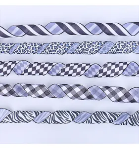 Detail view of various black and white patterned decorative ribbons for gift wrapping