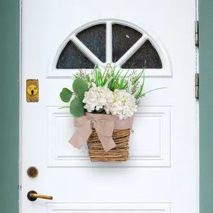 White hydrangea flower basket door hanger for home decoration on white wooden door
