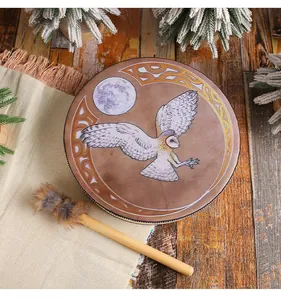 Close-up detail of handmade Siberian Shaman drum featuring an owl and moon print design